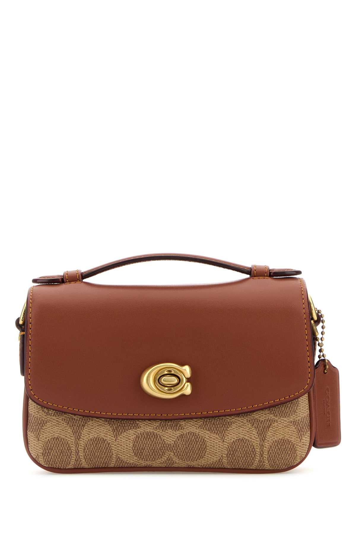 COATED_CANVAS_SIGNATURE_CASSIE_CROSSBODY_17_CW566_B4TANCARAMEL_Image_1